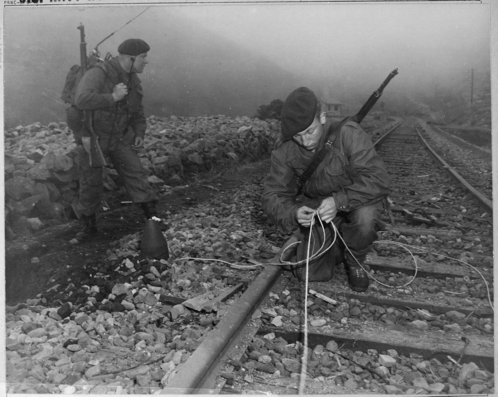 Commandoes_of_the_41st_Royal_British_Marines_plant_demolition_charges_along_railroad_tracks_of_enemy_supply_line..._-_NARA_-_520790.tif