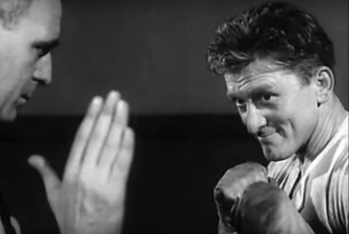 "Шампионът" (Champion)
Боксовата драма от 1949 г. носи на Дъглас номинация за "Оскар" заради главната му роля като Мидж Кели – бедно, амбициозно момче, което случайно научава, че боксът му се отдава съвсем естествено. Ранните си двубои печели с лекота и в крайна сметка става шампион на света. Но от един момент нататък – заради възрастта и други проблеми, започва обратен процес, който заплашва да унищожи живота и кариерата му. Ако героят на Кърк не може да се справи с тях, то самият актьор с лекота се справя с ролята.  