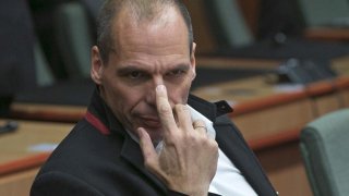 Greek Finance Minister Varoufakis waits for the start of an extraordinary euro zone Finance Ministers meeting to discuss Athens' plans to reverse austerity measures agreed as part of its bailout in Brussels