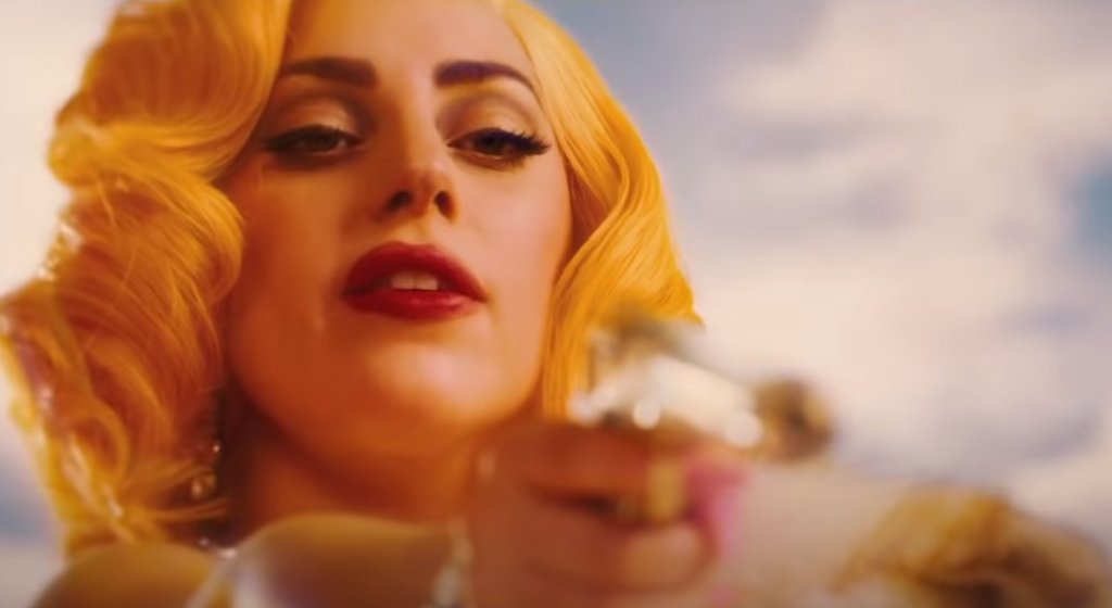 Machete Kills
Първата сериозна роля в киното (като под “сериозна” да се разбира роля с реплики и имена на героинята) за Гага е във филма на Робърт Родригес Machete Kills (“Мачете убива”).
В продължението на екшъна поп сензацията влиза в ролята на наемен убиец със слабост към луксозния начин на живот. Героинята на Гага Лейди Хамелеон е известна с това, че непрекъснато променя външния си вид, с което предизвиква интереса на мъжете около себе си.