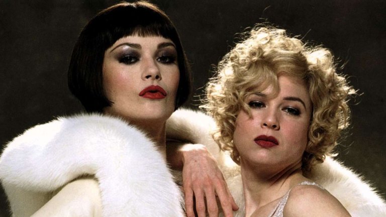 "Чикаго" (2002)
Мюзикълът "Чикаго” разказва историята на две жени в ерата на джаза, убили своите партньори. Докато сценичната версия е семпла продукция с изцяло черни декори и акцент върху хореографията, магията на киното надгражда представлението, показвайки на екран джаз клубове. Изпълненията на Катрин Зита-Джоунс, която спечели „Оскар“ за най-добра поддържаща актриса през 2003 г., и Рене Зелуегър (номинирана за най-добра актриса), Ричард Гиър, Джон С. Райли (номиниран за най-добър поддържащ актьор) и Куин Латифа (номинирана за най-добра поддържаща актриса) допринасят филмът да се превърне във фаворит както на зрителите, така и на филмовата критика. В крайна сметка, филмът печели пет "Оскара" от 13 номинации, включително за най-добър филм, и събра над 300 милиона долара в световен мащаб.