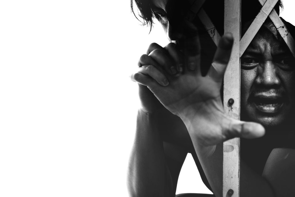 Exposure of a man in the dark Seeing he was thinking hard or anxious, a man with a tendency to commit a crime concept