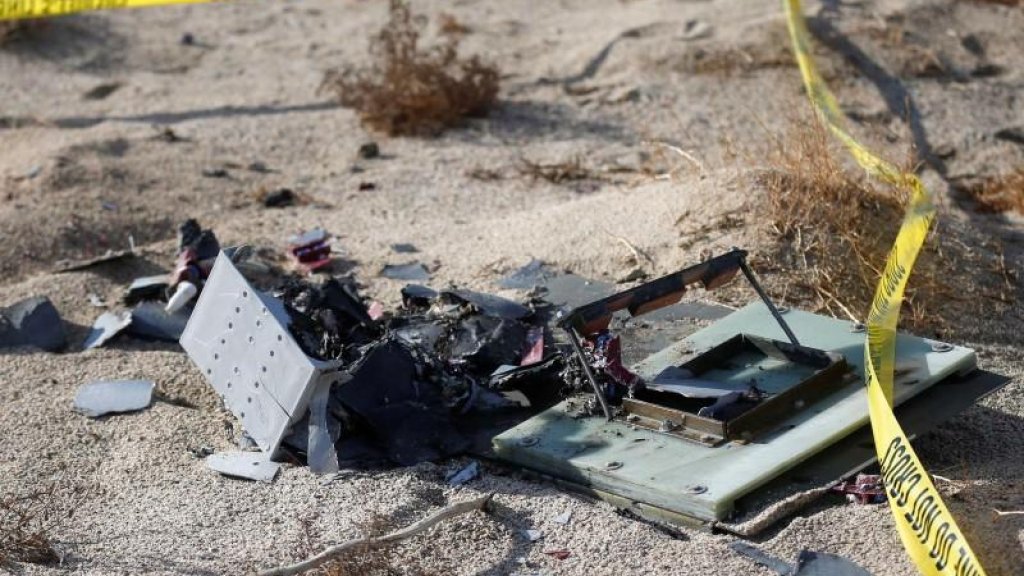 Piece of debris is seen near the crash site of Virgin Galactic's SpaceShipTwo near Cantil