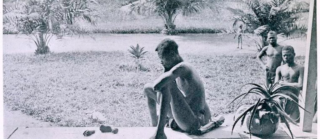 Nsala_of_Wala_in_Congo_looks_at_the_severed_hand_and_foot_of_his_five-year_old_daughter,_1904