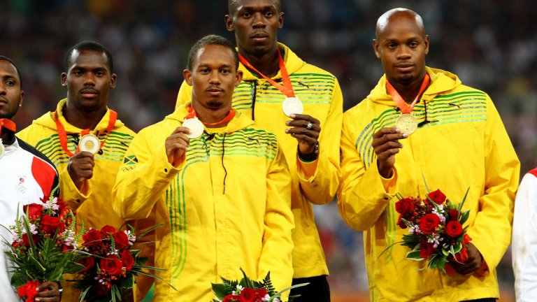 Неста Картър (най-вляво на снимката) е дал положителна проба за веществото метилхексанамин, заради което МОК отне златните медали на щафетата 4х100 м на Ямайка от Пекин 2008