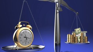 The relationship between time and money. Conceptual image.