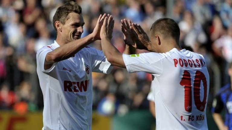 Лукас Подолски (вдясно) отбеляза два гола за разгрома на Кьолн над Фрайбург