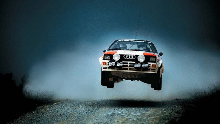 Audi Quattro (1980-1991)
Идеята за спортен автомобил със задвижване 4х4 е предложена от Йорг Бенсингер, инженер по шаситата на Audi, през 1977 година. Тезата му е, че такъв модел ще се справи с всеки свой съперник на сняг, дори и другата кола да е много по-мощна. Той започва работа по комби версията на 80 и се ражда Quattro. Купето с 2 врати става най-популярният модел на Audi през 80-те и натрупва легендарна слава в ралитата и в пистовите надпревари в цял свят. Днес Quattro се използва като название за всички модели на Audi със задвижване 4х4.