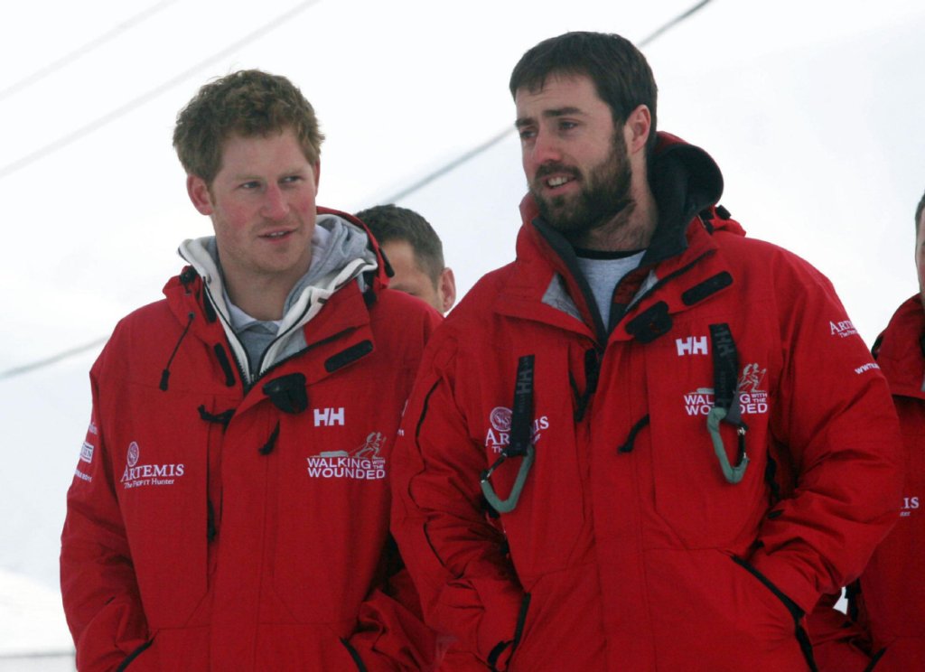 Britain's Prince Harry talks to Marti Hewitt as he meets Walking with the Wounded team members, on the island of Spitsbergen, between the Norwegian mainland and the North Pole