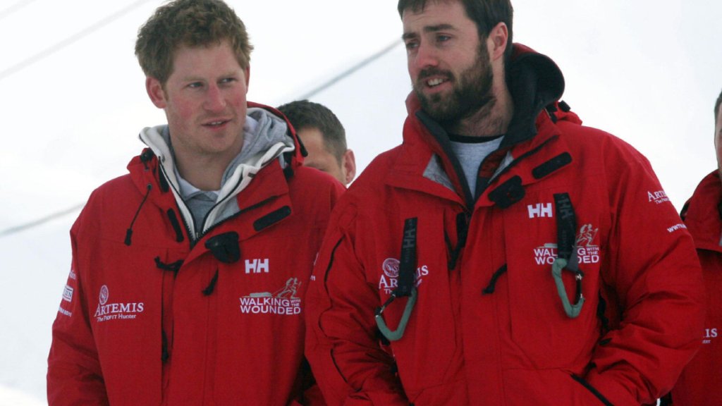 Britain's Prince Harry talks to Marti Hewitt as he meets Walking with the Wounded team members, on the island of Spitsbergen, between the Norwegian mainland and the North Pole
