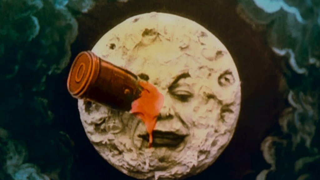le-voyage-moon-face-rocket-in-eye