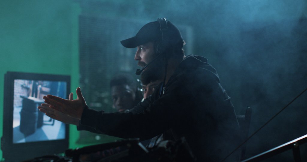 Movie director scolding team on shooting set