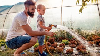 Father and son in garden