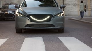 07-When-the-self-driving-car’s-sensors-detect-a-pedestrian-a-smile-lights-up-at-the-front-of-the-car-and-the-car-stops