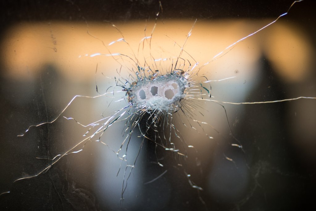 Bullet holes in a front windshield