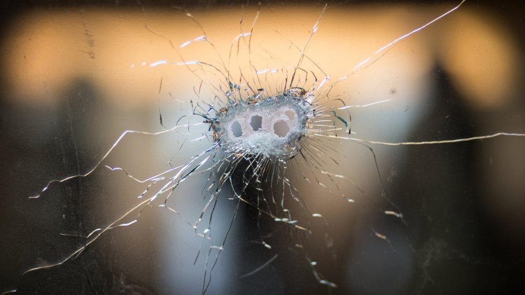 Bullet holes in a front windshield