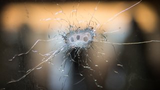 Bullet holes in a front windshield