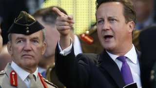 Britain's PM Cameron and Chief of the Defence Staff Houghton attend the opening ceremony of the Invictus Games in London