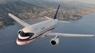 Air-to-air_photo_of_a_Sukhoi_Superjet_100_(RA-97004)_over_Italy