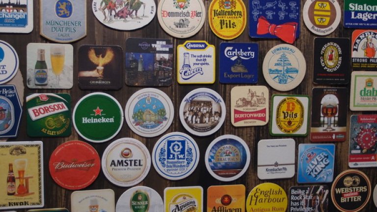 По стените до края на юли може да се види голяма колекция от подложки за бира...