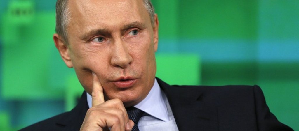Russian President Vladimir Putin speaks during his visit to the new studio complex of television channel 'Russia Today' in Moscow