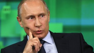 Russian President Vladimir Putin speaks during his visit to the new studio complex of television channel 'Russia Today' in Moscow