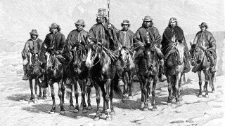 An Araucanian (Mapuche) chief and his staff, Chile/Argentina, 1895.