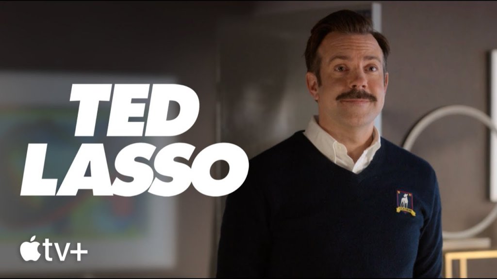 Ted Lasso (Apple TV+) - 23 юли
Забавният сериал за треньора по американски футбол, извикан да ръководи британски футболен отбор, продължава. Шоуто вече спечели много фенове с първия си сезон, в който добронамереният, мустакат герой на Джейсън Съдейкис се опитва да направи от футболистите си по-добри хора и едва след това да печели мачове.
Сега обаче е време за малко повече футбол, след като отборът изпадна от Висшата лига. Дали нещо от това обаче ще промени стила на Тед Ласо? Никакъв шанс.