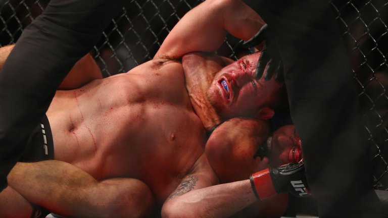 Rear naked choke and THE NEW UFC middleweight champion is...
