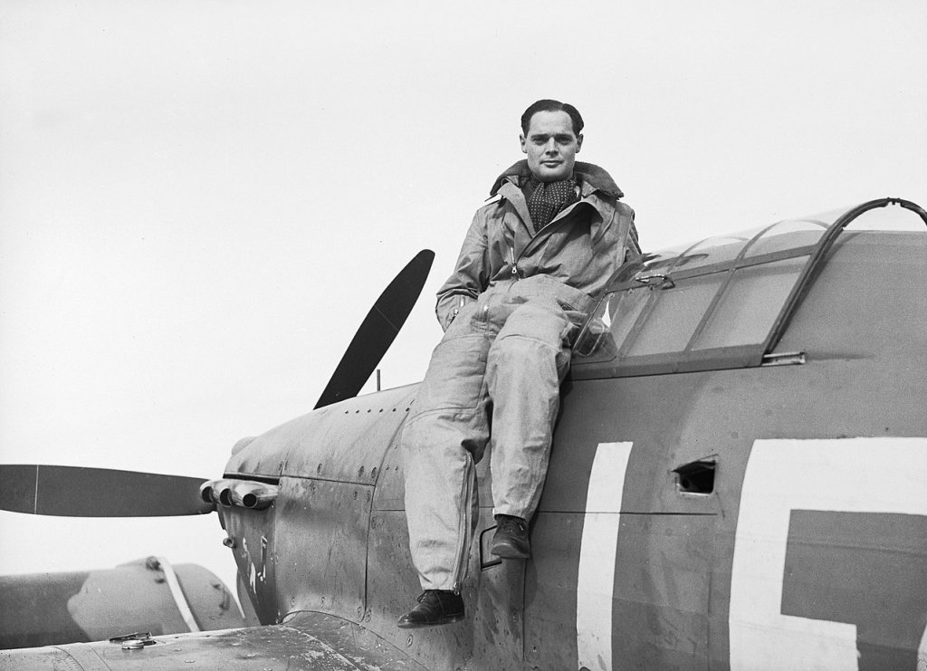 1280px-Squadron_Leader_Douglas_Bader,_CO_of_No._242_Squadron,_seated_on_his_Hawker_Hurricane_at_Duxford,_September_1940._CH1406