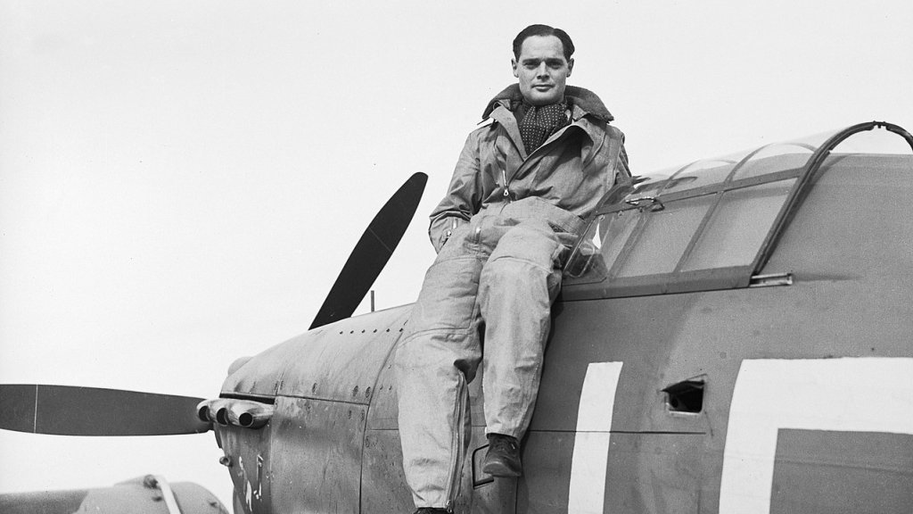 1280px-Squadron_Leader_Douglas_Bader,_CO_of_No._242_Squadron,_seated_on_his_Hawker_Hurricane_at_Duxford,_September_1940._CH1406