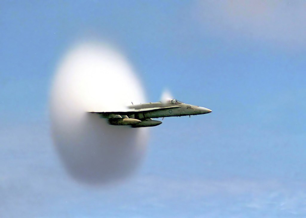 1024px-FA-18_Hornet_breaking_sound_barrier_(7_July_1999)_-_filtered