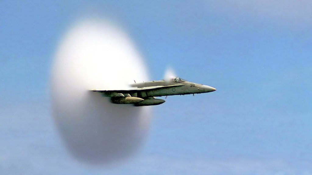 1024px-FA-18_Hornet_breaking_sound_barrier_(7_July_1999)_-_filtered