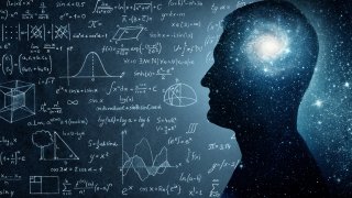 The universe within. Silhouette of a man inside the universe, physical and mathematical formulas..