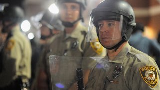 Protests errupt after Ferguson Mayor announces resignation of city Police Chief