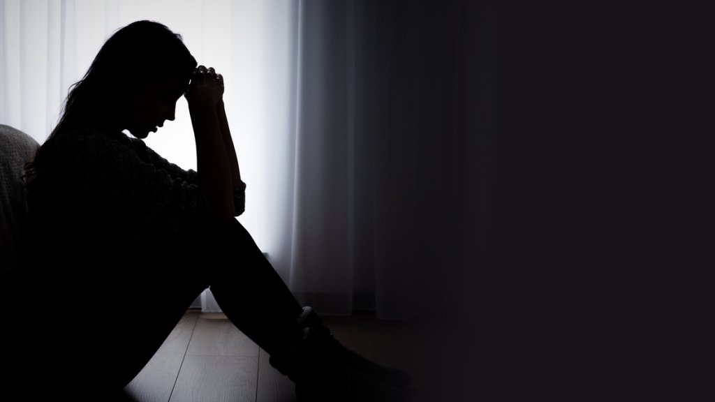 Depressed woman. Sadness and headache concept