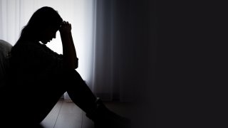 Depressed woman. Sadness and headache concept