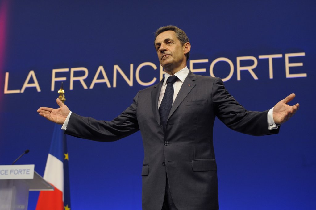 France's President and UMP party candidate for the 2012 French presidential elections Nicolas Sarkozy acknowledges the reactions of the audience at the end of an campaign rally in Nice