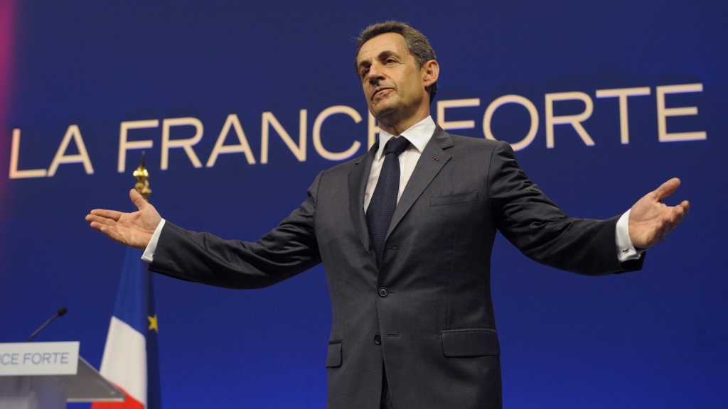 France's President and UMP party candidate for the 2012 French presidential elections Nicolas Sarkozy acknowledges the reactions of the audience at the end of an campaign rally in Nice