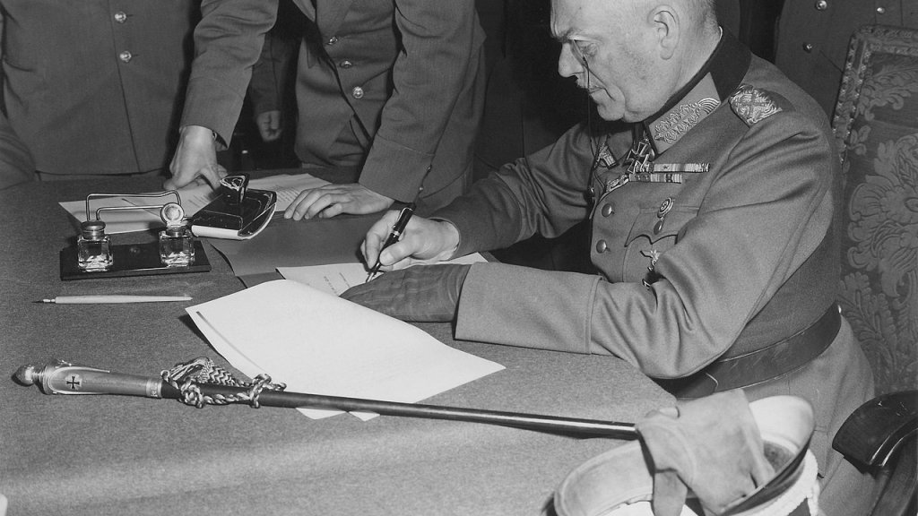 1280px-Field_Marshall_Keitel_signs_German_surrender_terms_in_Berlin_8_May_1945_-_Restoration