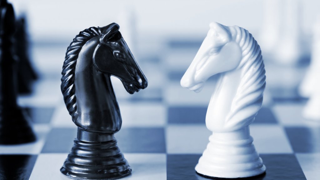 Black versus white chess knights on a board
