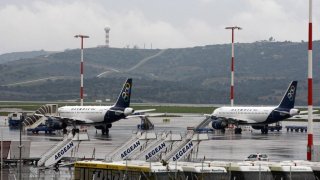 Aegean_Olympic jetliners on the tarmac at Athens International Airport