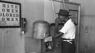 _Colored__drinking_fountain_from_mid-20th_century_with_african-american_drinking