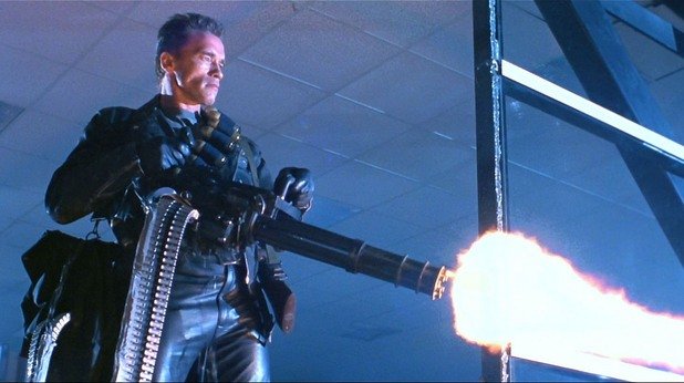 Minigun - Terminator 2: Judgment Day/"Терминатор 2"
Пушката помпа е може би първото оръжие, за което човек се сеща от поредицата с Арнолд Шварценегер, но епичната мощ, която струи от терминатора, награбил Minigun, не е за изпускане. Впоследствие многоцевната, скорострелна картечница се превръща в нещо, което се използва масово от франчайза, с което си печели и тази култова слава. На това му се казва "Hasta la vista, baby"!
