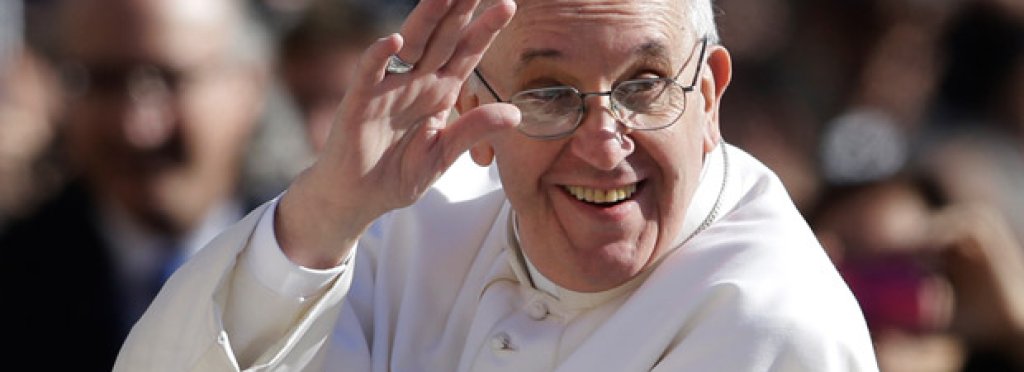 Pope Francis waves to crowds as he arrives to his inauguration mass on 19 March 2013.