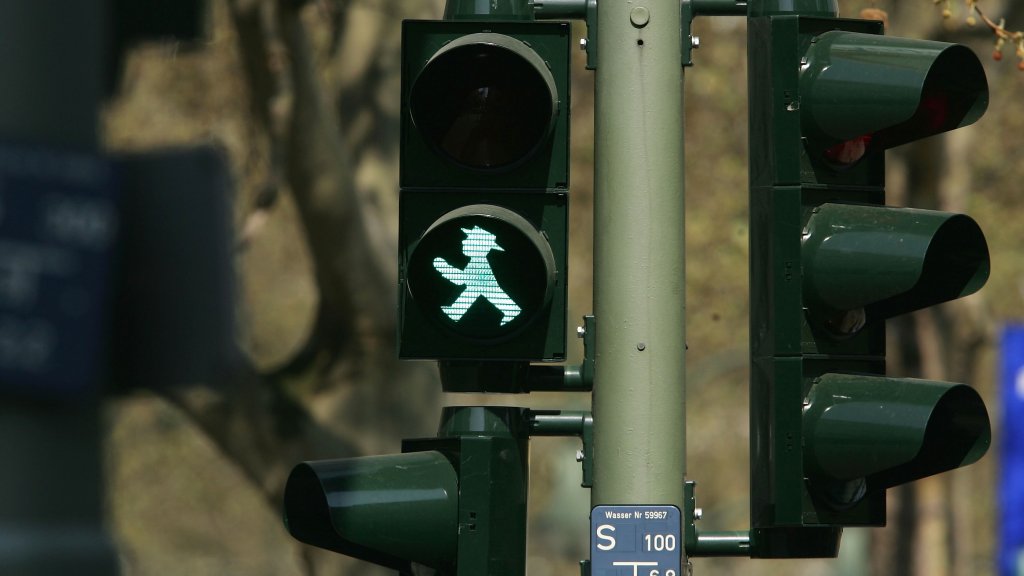 Legal Battle Emerges Over Stoplight Pedestrian Figure