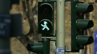 Legal Battle Emerges Over Stoplight Pedestrian Figure