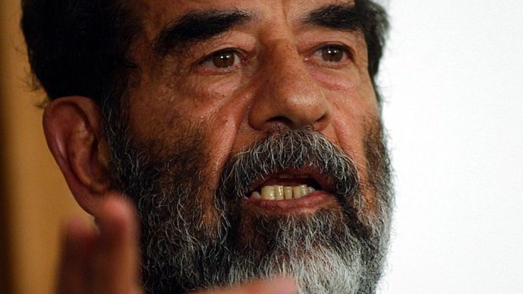 667px-Saddam_Hussein_at_trial,_July_2004