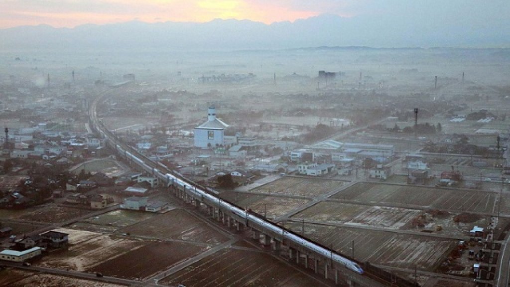 The first train of the new Hokuriku shinkansen or bullet train, bound for Tokyo, runs near Shin-Takaoka Station in Takaoka, Toyama prefecture