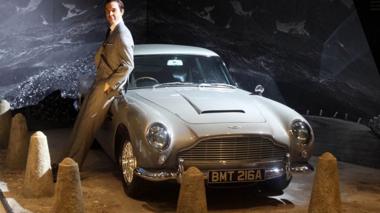 Aston Martin DB5 
Aston Martin DB5 е колата, която Шон Конъри кара в "007: Goldfinger". Този август модел от нея беше продаден за впечатляващите 6,8 млн. долара. Така автомобилът влиза историята като най-скъпия Aston Martin, продаван някога. 
Автомобилът, който беше закупен на аукцион, всъщност не участва във филма, но е точно копие на този, който Конъри кара (и разбива в един момент), а освен това е напълно реставриран през 2012 г. Снабден е с различни "одобрени от Ми-6" екстри като въртяща се регистрационна табела и бронирани стъкла.